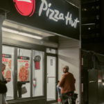 How far does Pizza Hut deliver in the US?